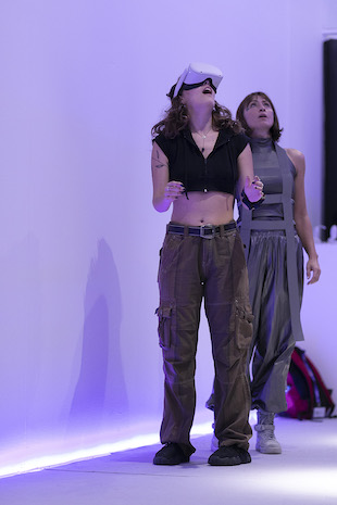 A person looks into the air with a VR headset on A person looks into the air with a VR headset on