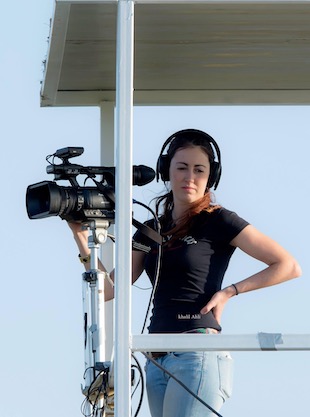 Image shows Georgina Sadler behind the camera at an F1 race Image shows Georgina Sadler behind the camera at an F1 race