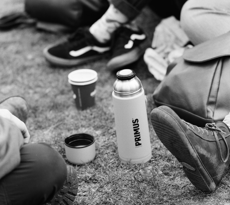 Black and white photo shows several people sitting - just out of shot - around a large flask with a hot drink. Image by Benjamin Kaufmann via Unsplash Black and white photo shows several people sitting - just out of shot - around a large flask with a hot drink. Image by Benjamin Kaufmann via Unsplash
