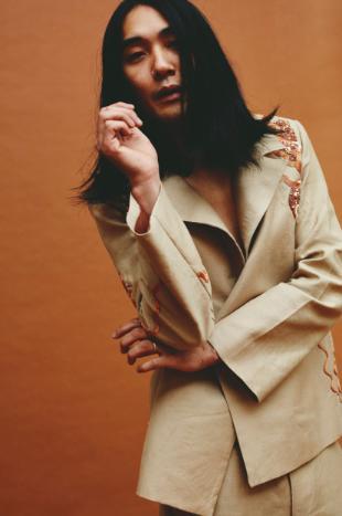 Model wears beige embroidered tailoring Model wears beige embroidered tailoring